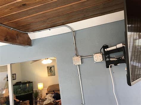 exposed conduit to wall wiring